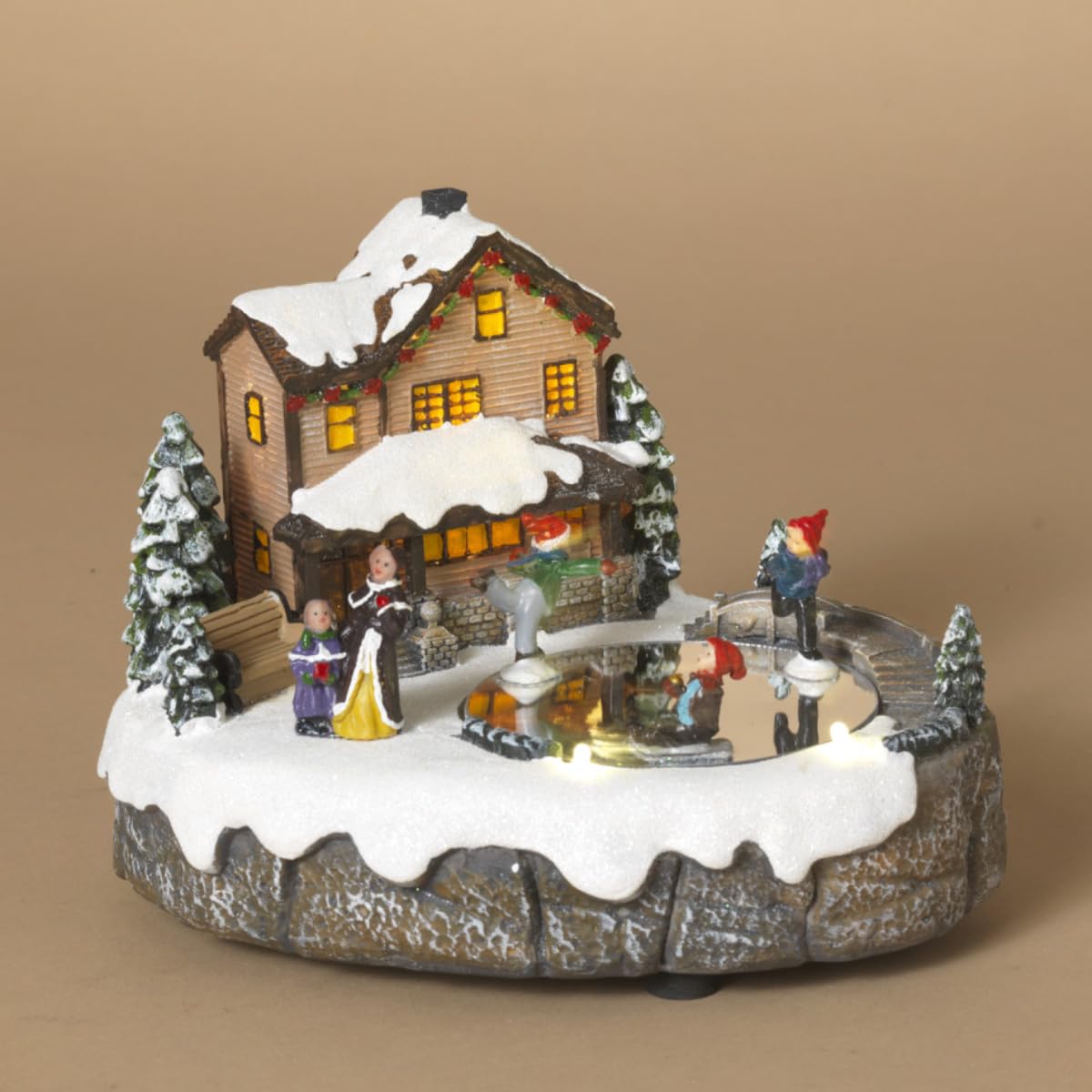 Decoratiune Craciun cu Casuta Luminata si patinatori – platforma rotativa iluminata si melodii de Craciun