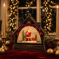 Decoratiune LED Muzicală de Crăciun tip Căsuță, cu Moș Crăciun, Efect de Ninsoare, Muzică și Iluminare Caldă – 23 × 8 × 20 cm